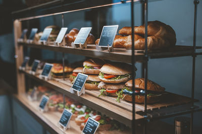 Varieties of bread specialties arranged on display in cafe