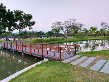 Footbridge over lake in park