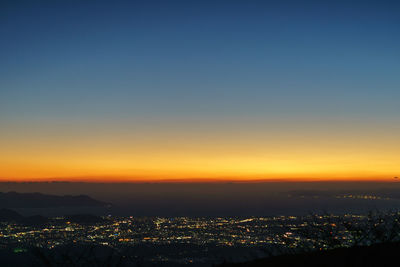 Aerial view of cityscape at sunset