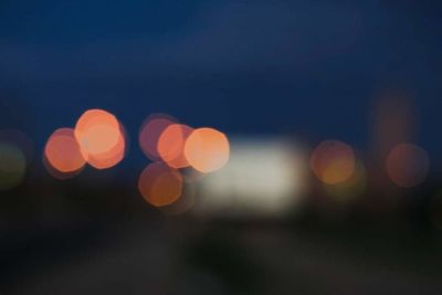 Defocused image of illuminated lights at night