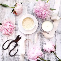 Coffee, candle and flowers