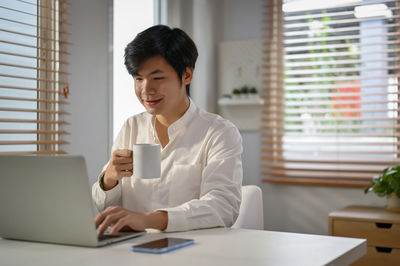 Businesswoman working at table