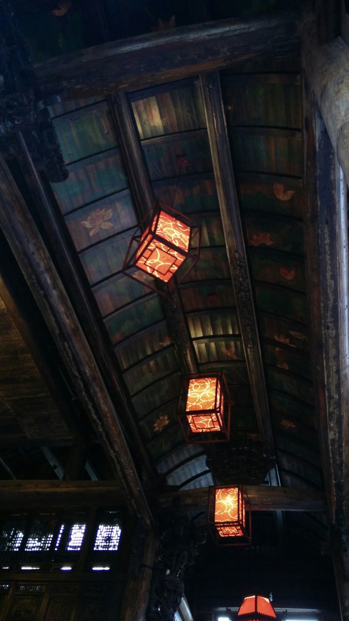 low angle view, architecture, built structure, illuminated, ceiling, lighting equipment, indoors, building exterior, building, window, old, night, no people, abandoned, house, interior, electric light, hanging, brick wall, electricity