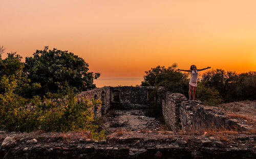 Scenic view of landscape against clear sky during sunset