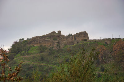 Built structure on land against sky