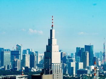 High angle view of cityscape against blue sky