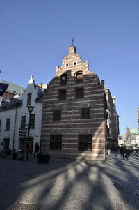 Low angle view of building against clear blue sky
