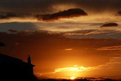 Low angle view of cloudy sky at sunset