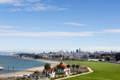 People in city against sky