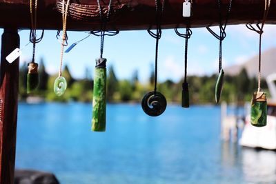 Close-up of water hanging against sky