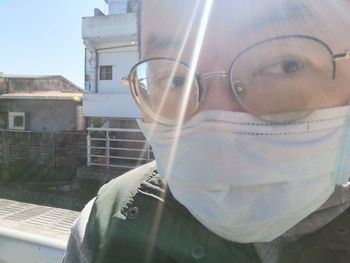 Portrait of man wearing eyeglasses