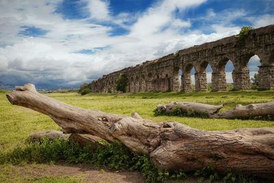 Low angle view of historical building against cloudy sky