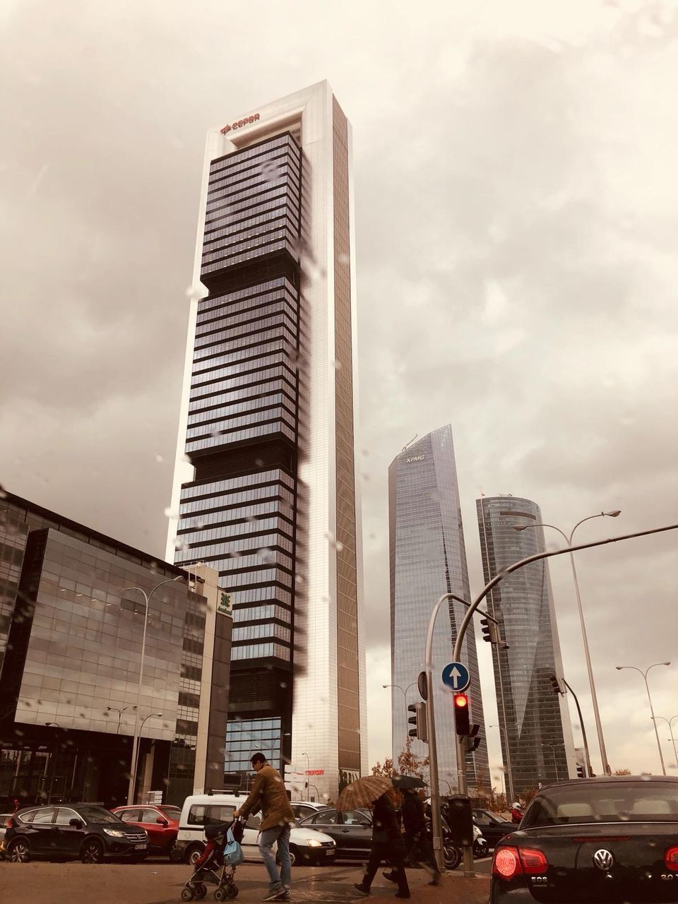 VIEW OF CITY STREET AND MODERN BUILDINGS AGAINST SKY