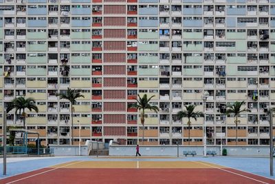 Playing field in front of buildings in city