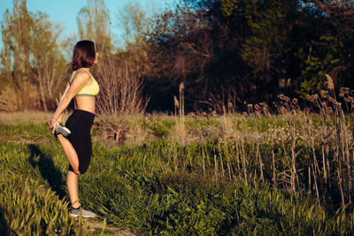 Rear view of woman on field