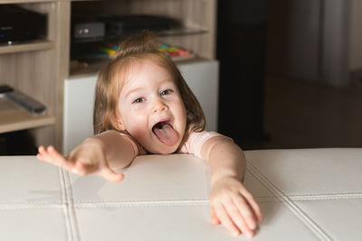 Portrait of cute baby at home