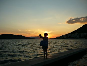 Scenic view of sea at sunset