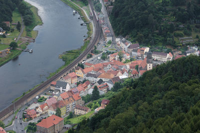 High angle view of houses and river in town