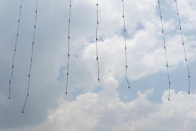 Low angle view of cables against sky