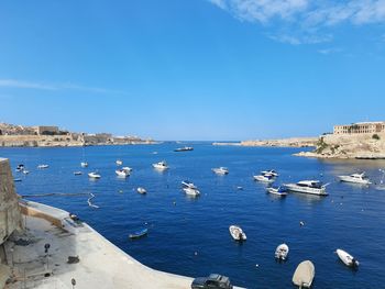 Scenic view of sea against blue sky