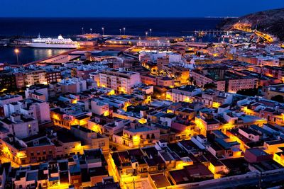 High angle view of buildings at night