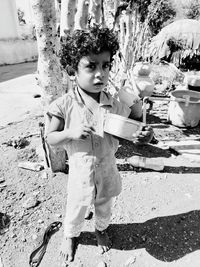 Full length of boy standing outdoors