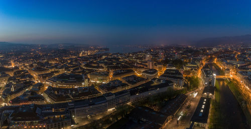 High angle view of illuminated buildings in city at night