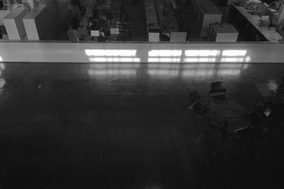 High angle view of chairs on table in city