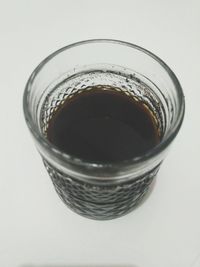 High angle view of coffee on table against white background