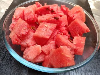 High angle view of chopped fruits in bowl on table