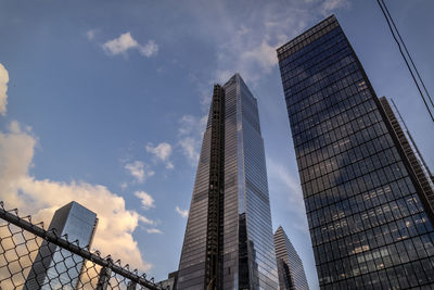 Low angle view of modern buildings against sky