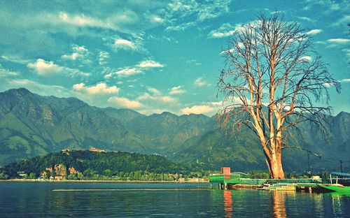 Scenic view of lake against cloudy sky
