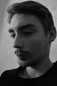 Close-up portrait of young man looking away