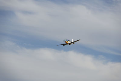 Low angle view of airplane flying in sky