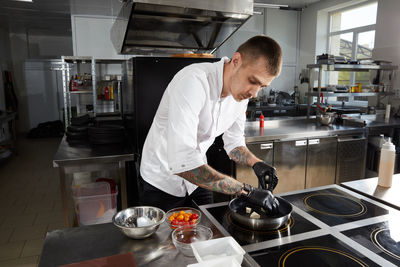 Man preparing food in kitchen