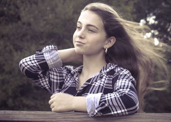 Portrait of young woman looking away