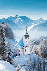 Snow covered maria gern church on mountain