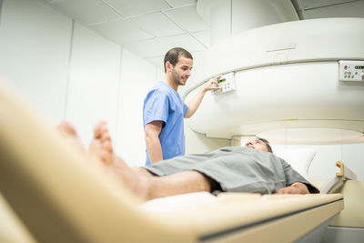 Full length of a man lying down for mri scan