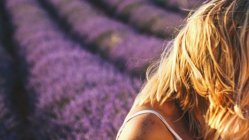 Close-up of woman standing at lavender farm