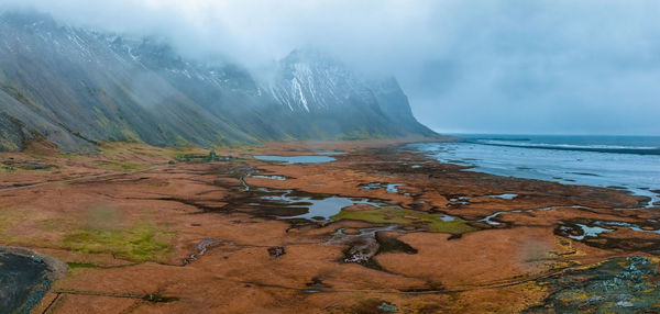 Aerial view of a viking village on a stormy rainy day in iceland.