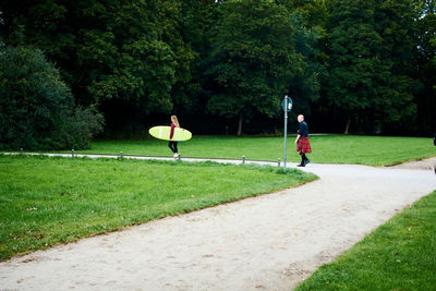 Rear view of man playing in park