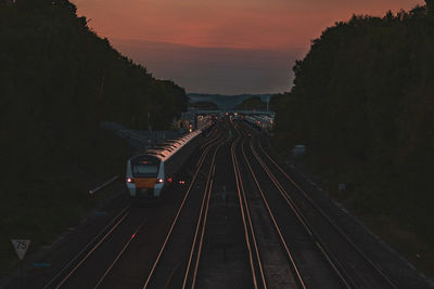 High angle view of railroad tracks at sunset
