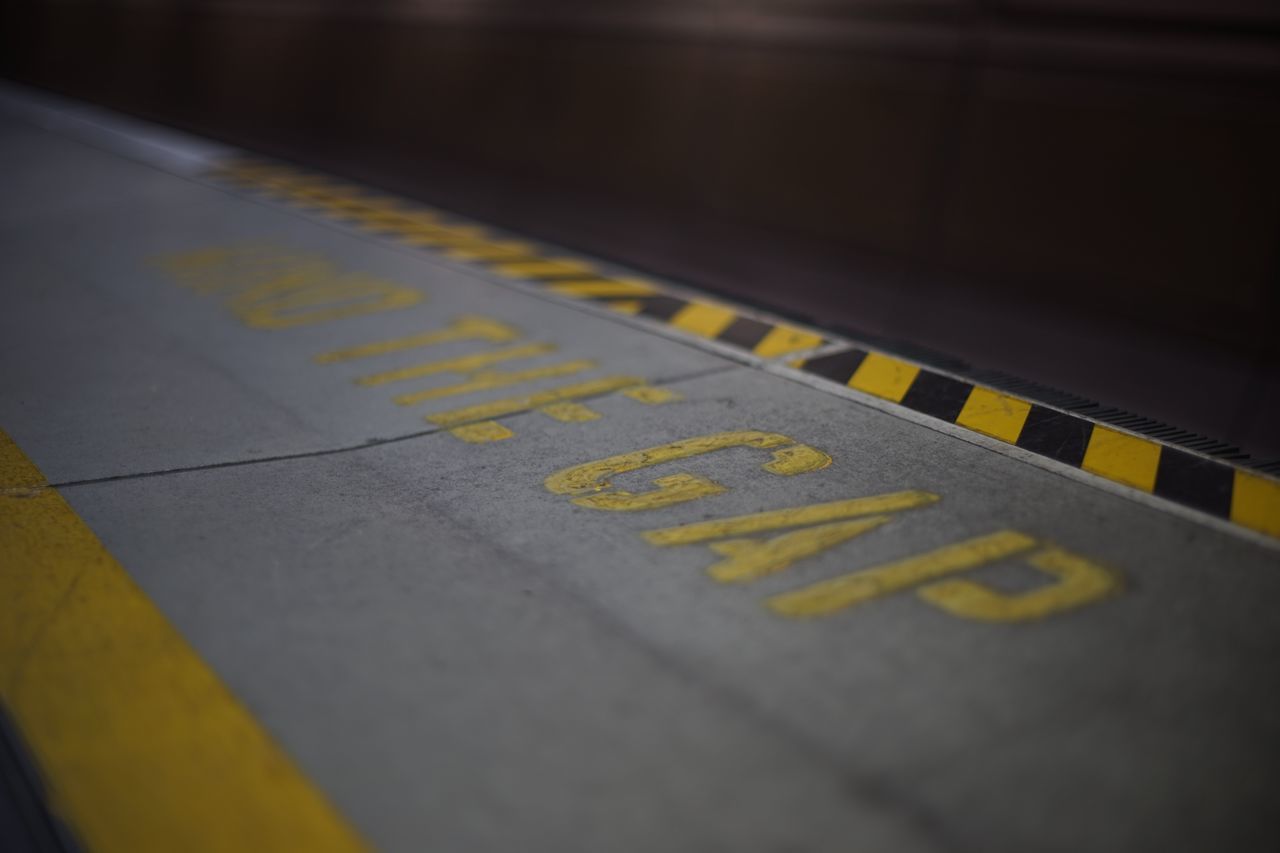 HIGH ANGLE VIEW OF ARROW SIGN ON CAR