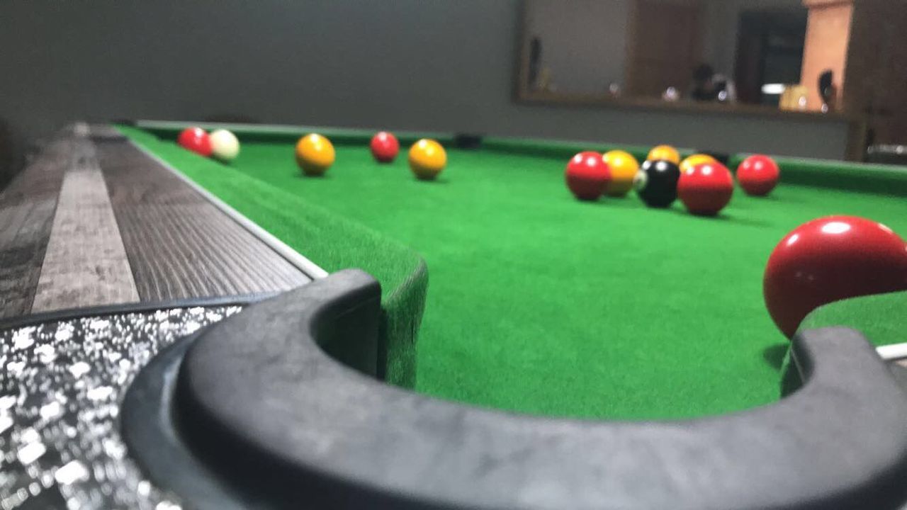 sport, ball, table, pool table, pool ball, leisure activity, pool - cue sport, green color, leisure games, close-up, snooker, indoors, pool cue, relaxation, selective focus, no people, playing, sphere, competition, sports equipment, nightlife, pool hall