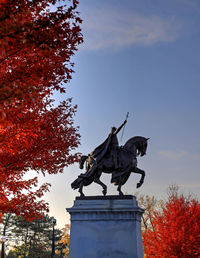 Low angle view of statue against sky