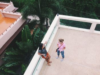 High angle view of women talking on terrace