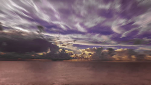 Scenic view of sea against dramatic sky