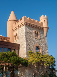 Low angle view of building against blue sky