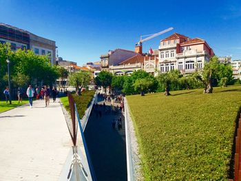People in park against blue sky