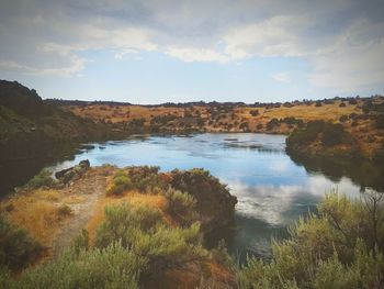 Scenic view of river against sky